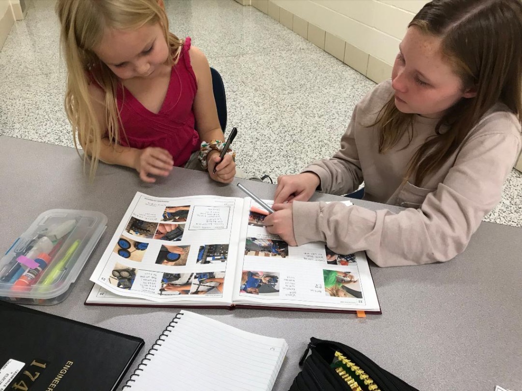 Picture of Lauren helping Cedarville with their Engineering Notebook.